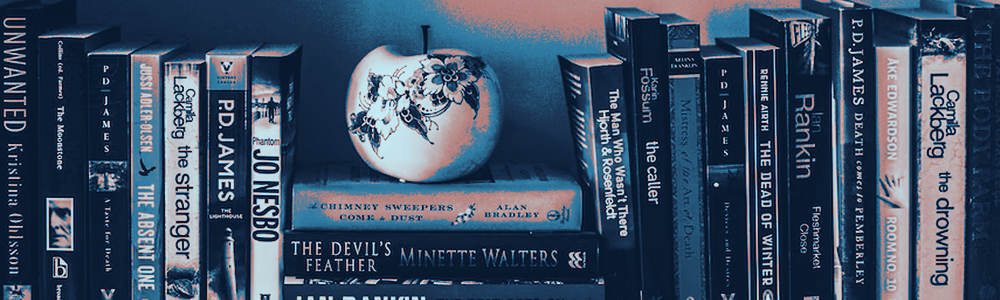 A bookshelf with a decorative apple in the middle.