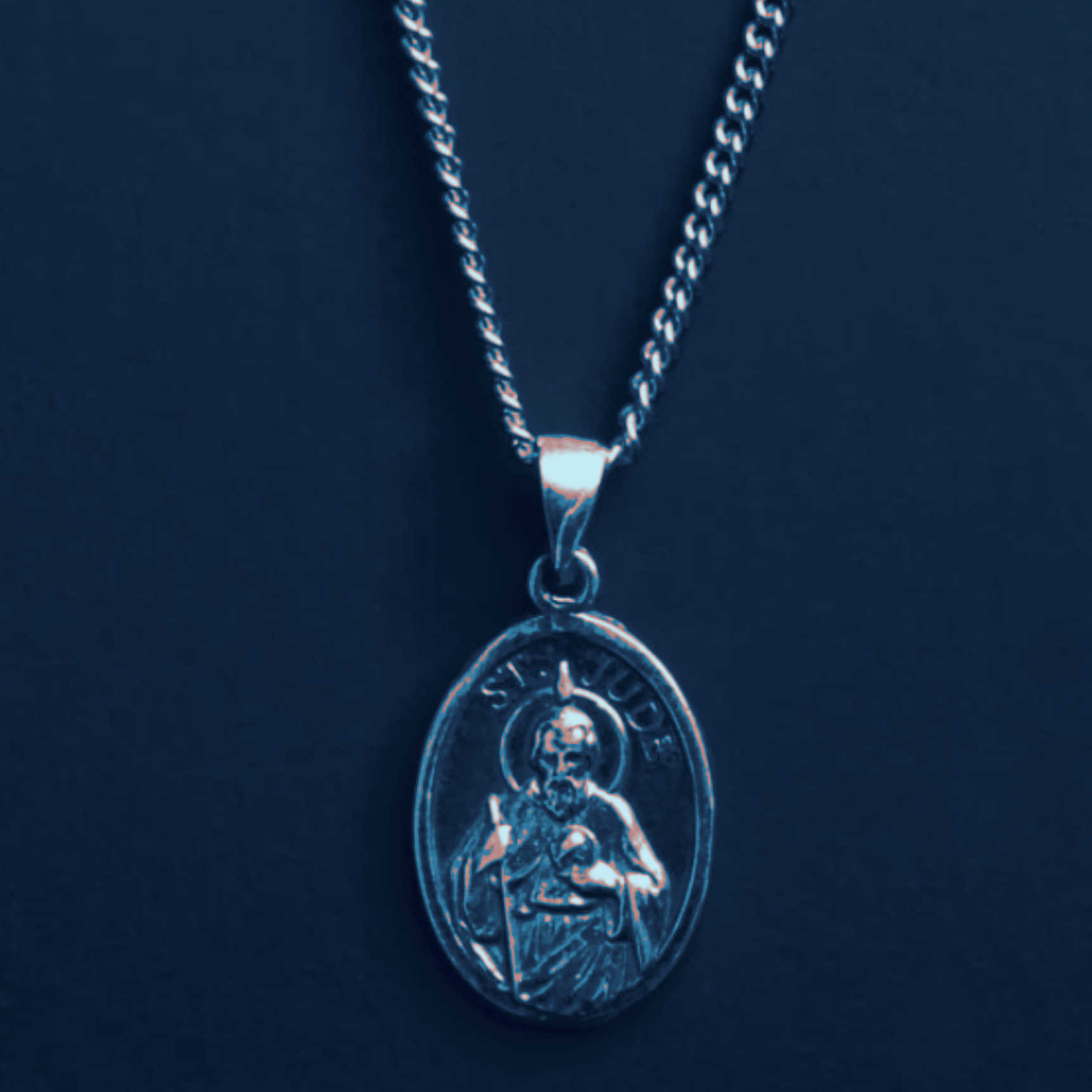 A necklace with a pendant of Saint Jude.